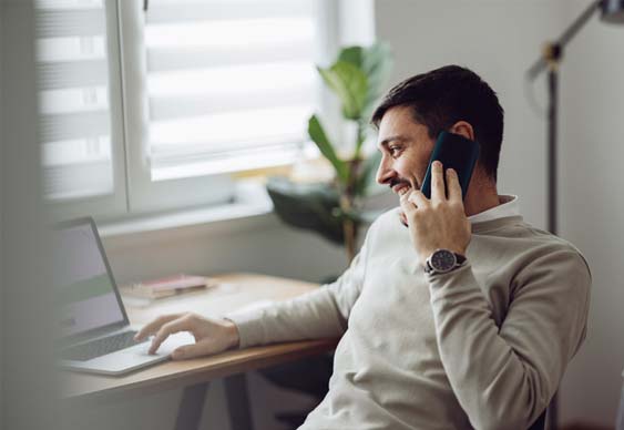 Man on phone taking a reference check