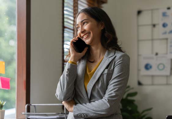 Woman on phone receiving a reference check call